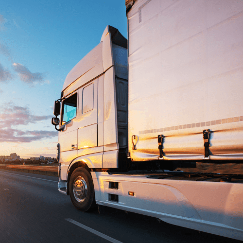Truck cabin driving on road with blue sky and sunset